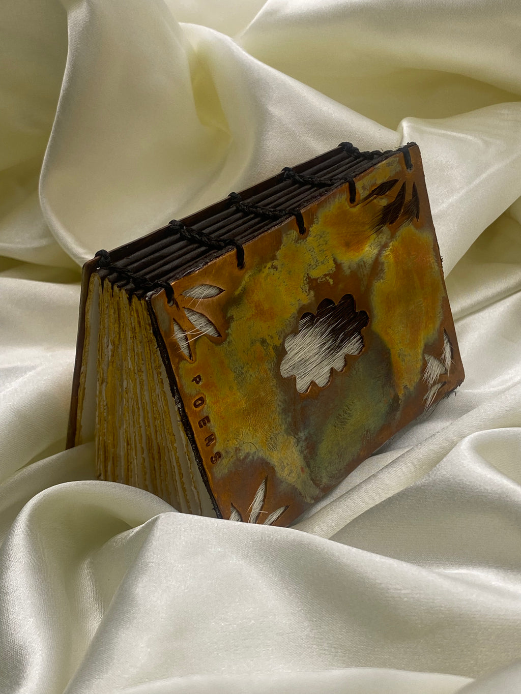 Pocket copper poem book
