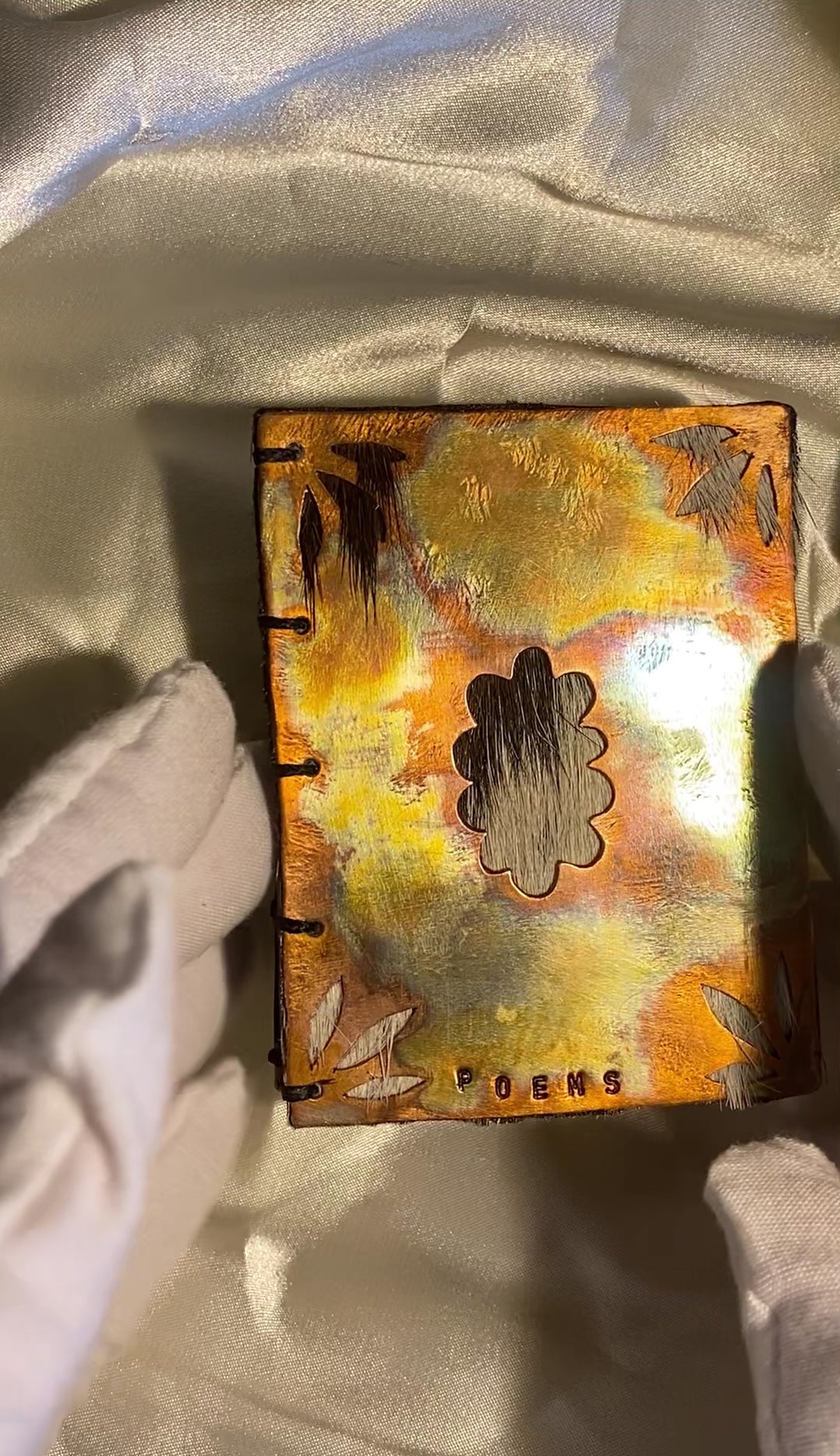 Pocket copper poem book